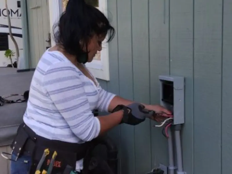 Licensed electrician wiring an exterior subpanel in Middleborough