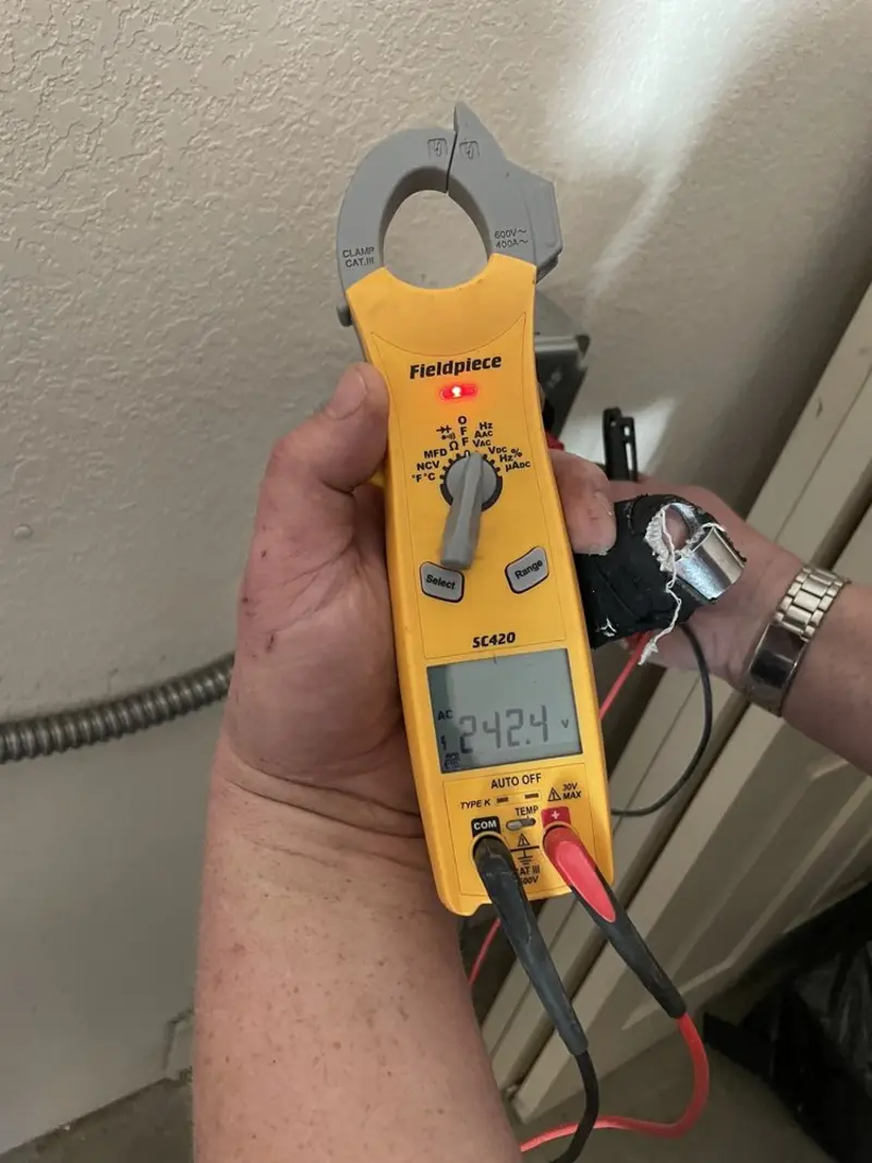 Voltage testing with clamp meter during Outlet Installation in Middleborough